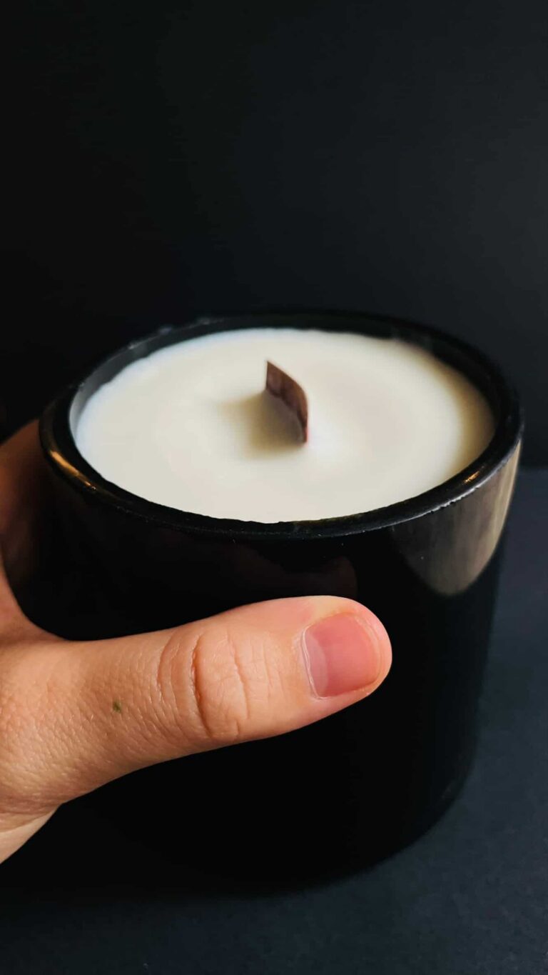 big candle mediterrenean scent soy wax recycled black glass in toris hand